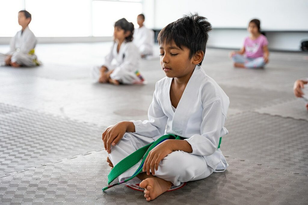 Child practicing meditation at Warrior Academy