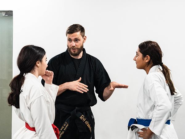 Warrior Academy instructor talking to students
