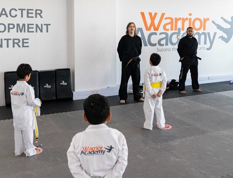 Children at Warrior Academy practicing martial arts as an after school activity.