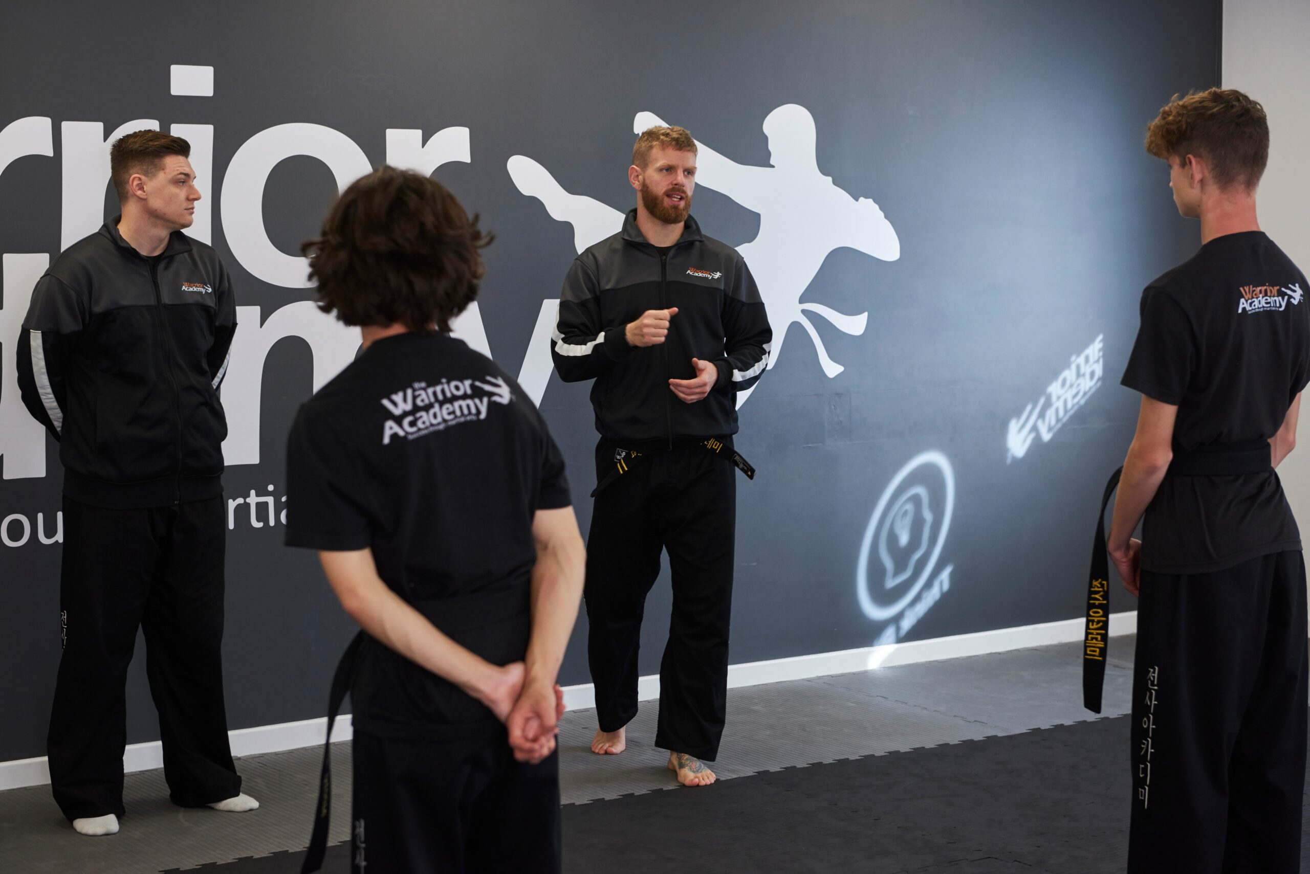 Instructors at Warrior Academy teaching teenage students