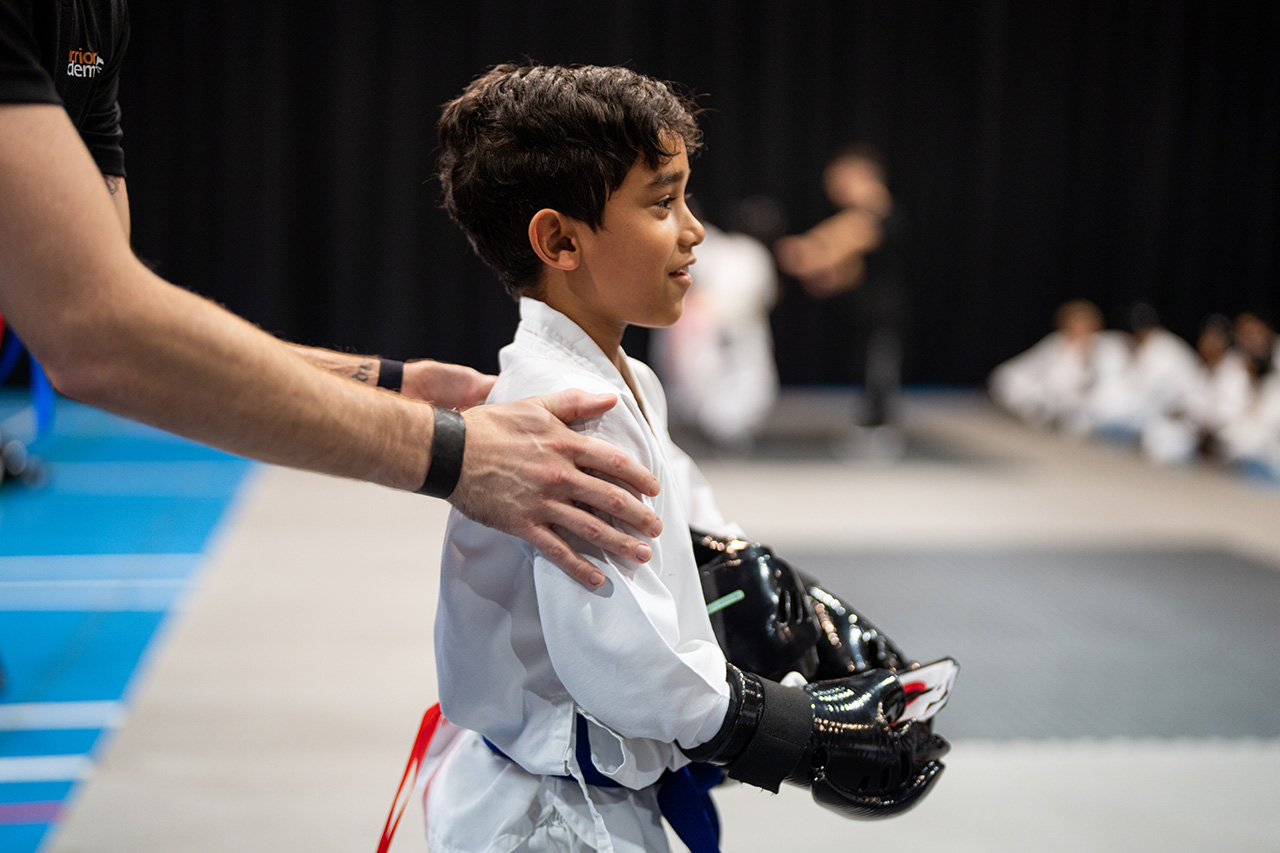 Warrior Academy student watching competition