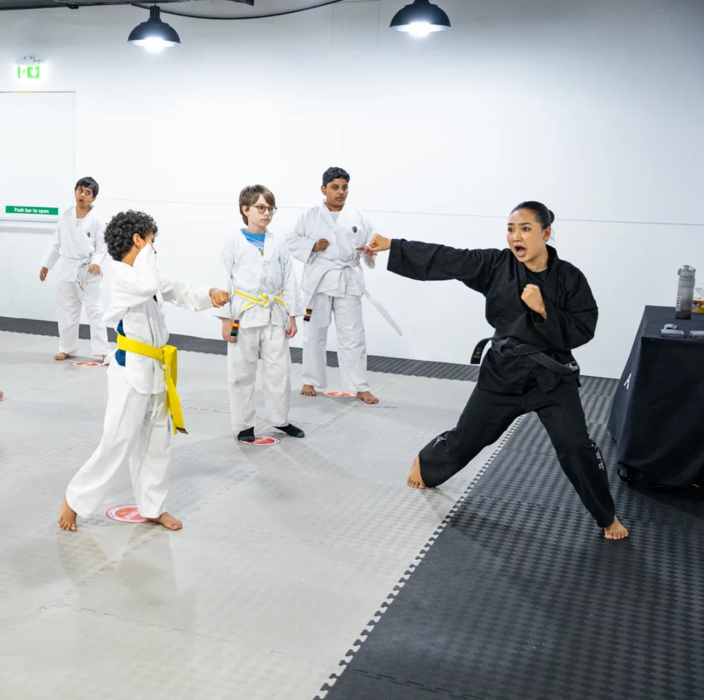 Children practicing techniques at Warrior Academy