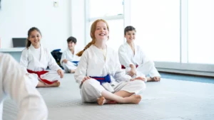 Happy child training martial arts at Warrior Academy Dubai