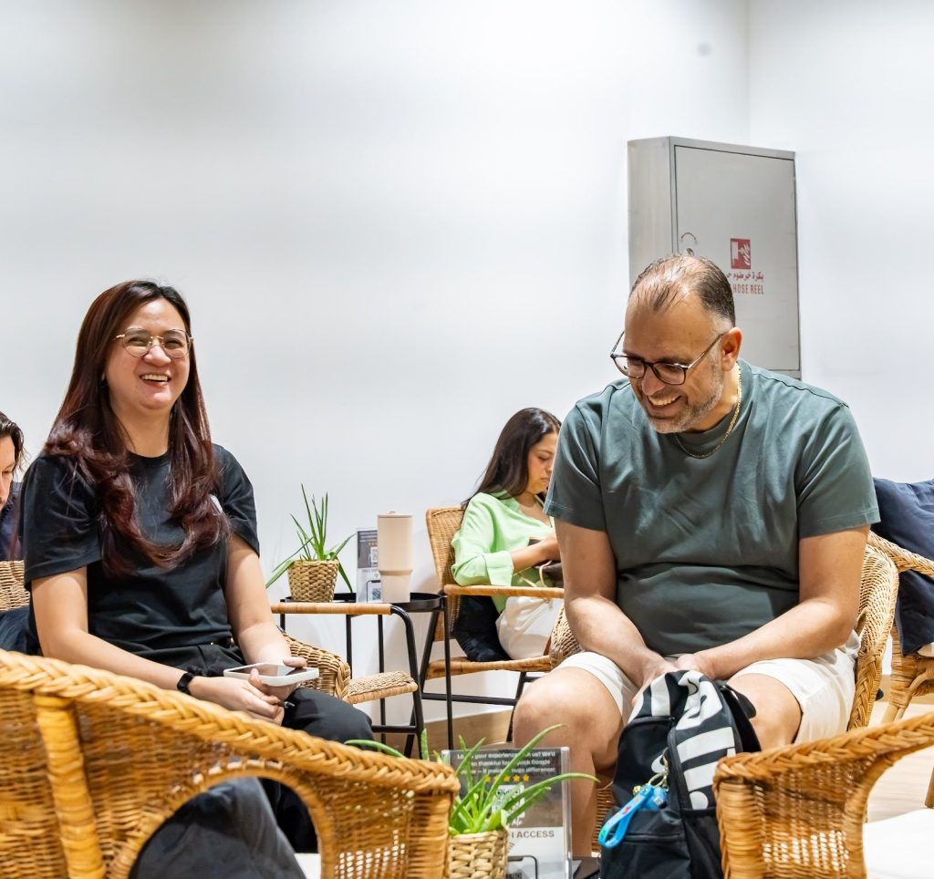 A member of our sales team sharing a laugh with a parent at The Warrior Academy