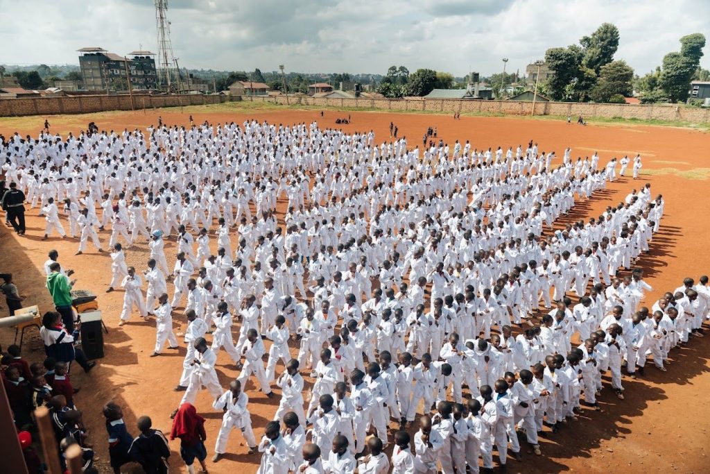 Hundreds of children training together at a Bates Foundation class in Kenya