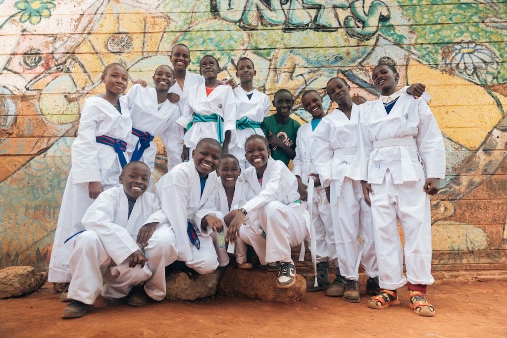 Smiling Bates Foundation students in Kenya with their new belts