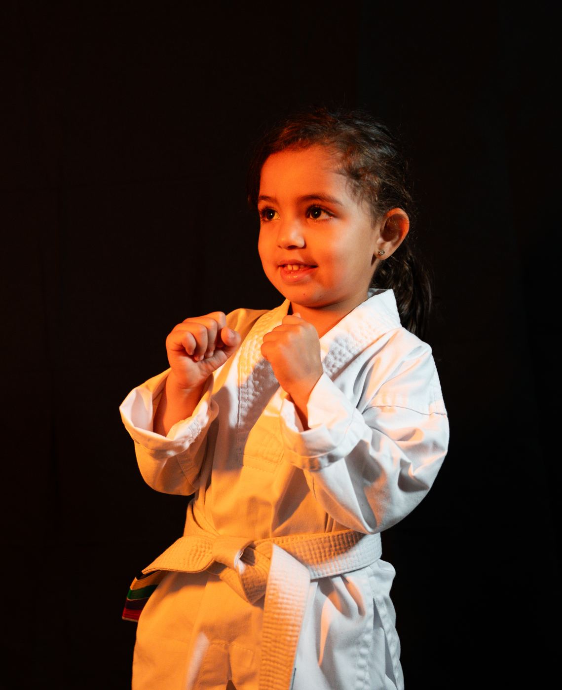 A little girl in a ready stance at The Warrior Academy